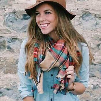 Young woman with denim shirt, hat and scarf